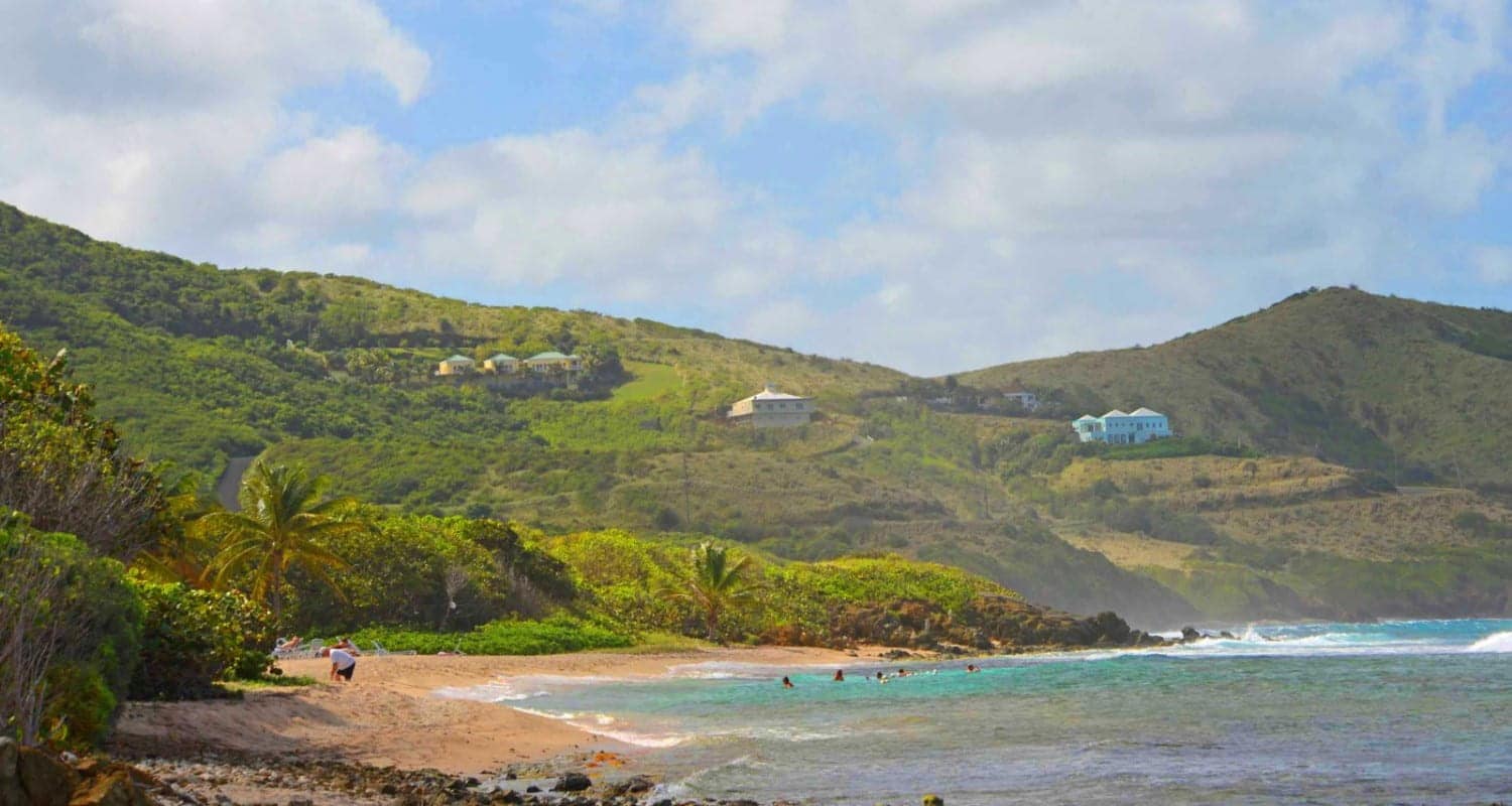 wide quiet beach in St. Croix with clear water and few people